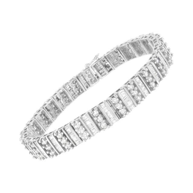 Embellish your wrist with this striking 14k white gold bracelet. 4 7/8ct TDW of dazzling diamonds are displayed in this...