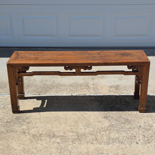This is a traditional Asian style carved elm wood bench that measures 46” long, 11.75” deep, and 19” tall. It can be used...