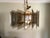 Italian crafted geometric small chandelier with layered smoked glass and polished brass hardware; circa 1970s.