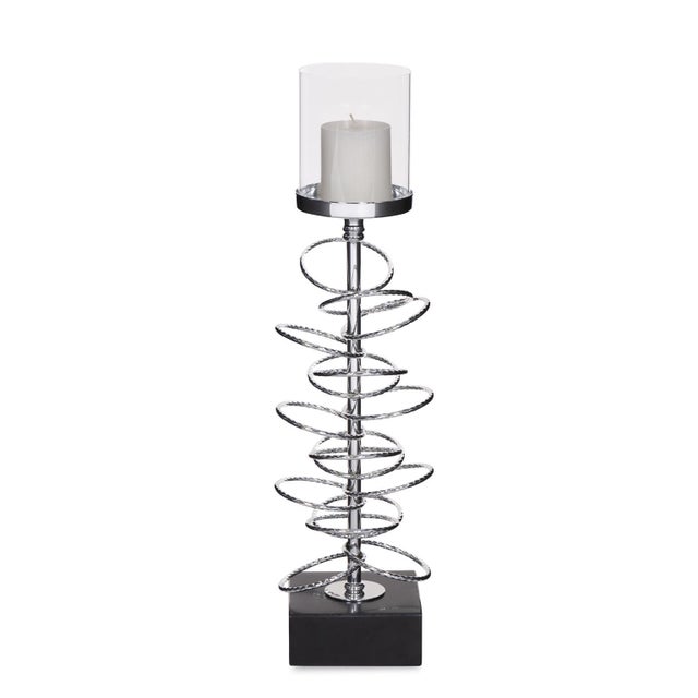 Our Ring Toss Candle Holder features iron rings encircling a central rod. The entire piece is finished in a silver...