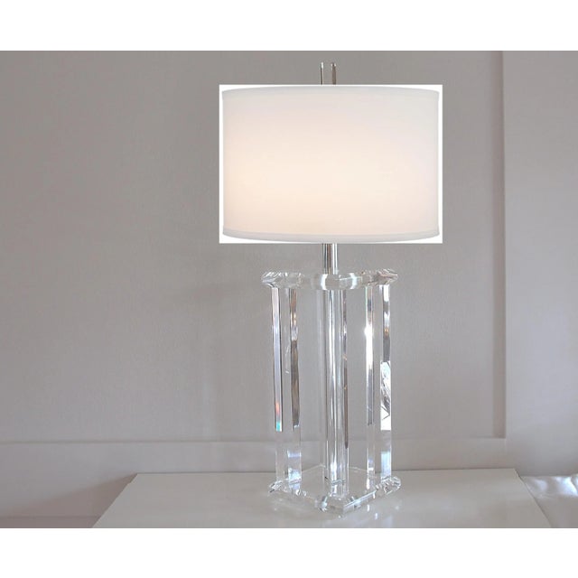 Modernist acrylic lamp, circa 1960's, with square top and base with 4 acrylic square columns supports and a chrome...
