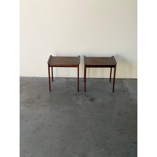 Beautiful pair of vintage Danish rosewood nightstands by Heltborg Møbler, featuring rich rosewood grain, elegant tapered...