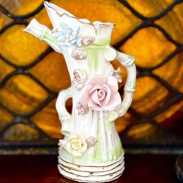 This unique 1950s porcelain vase is a cherished heirloom from the seller's grandfather. It features a striking multi-spout...