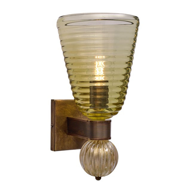 A sophisticated pair of contemporary Murano glass sconces combining sculptural olive-green glass, 24 carat gold inclusions...