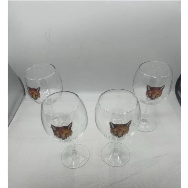 A charming set of four vintage stemmed wine glasses featuring beautifully detailed fox portraits. With their classic...
