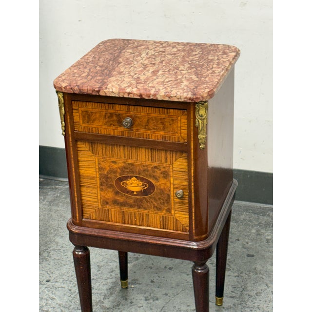 Design Plus Gallery presents Pair of Antique French Louis XVI Style Marble-Top Side Tables. This matching pair of antique...