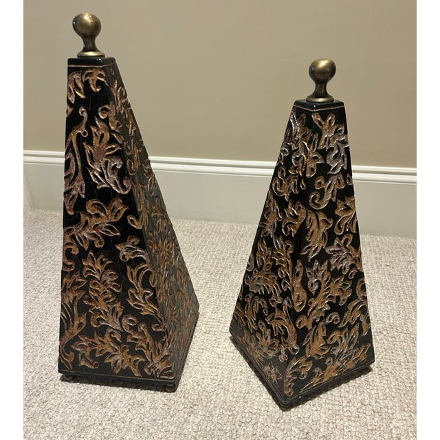 Pair of black pyramid obelisks with chinoiserie pattern with engraved in gold and silver. Black lacquer crackle finish...