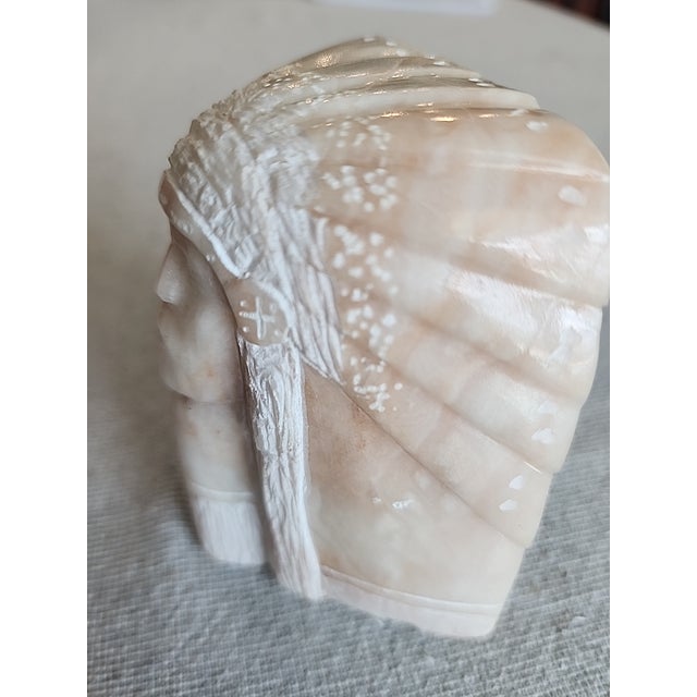 Hand carved Alabaster sculpture of Native American Chuef. Signed with the initials L.H. on bottom. Approx 3.75in. wide and...
