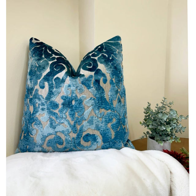 Add an elegant touch to your space with this stunning blue velvet brocade pillow. The intricate pattern combines rich hues...