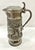 Vintage pewter pitcher. Heavily embossed hunting scene encircles this tankard. Decorative curved handle. The pitcher...