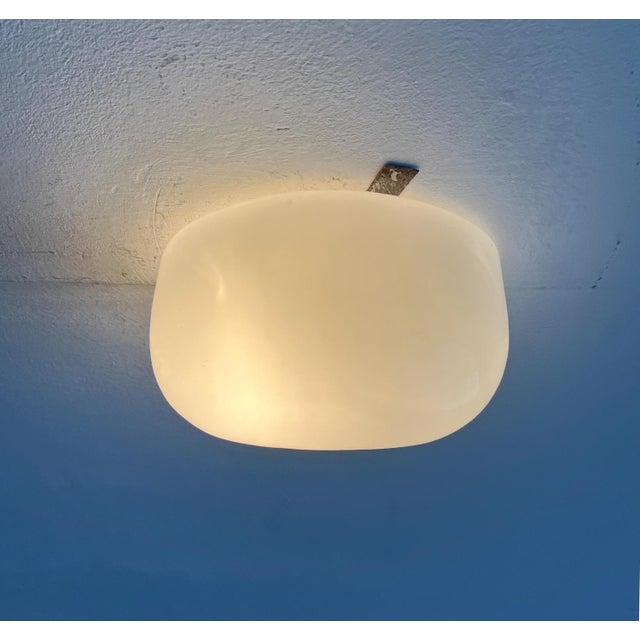 Minimalist mid-century ceiling or wall light from the German manufacturer BUR Leuchten. The glass has a simple but...