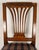 A handsome 19th-century French Directoire style walnut side chair, featuring a tall rectangular back with an elegant...