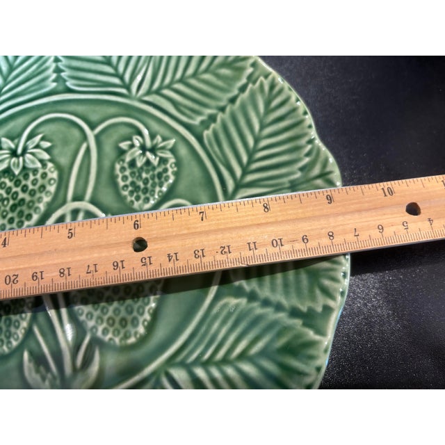 This is a beautiful green 9.5 inch plate by Bordallo Pinheiro China company from Portugal. The plate features strawberries...
