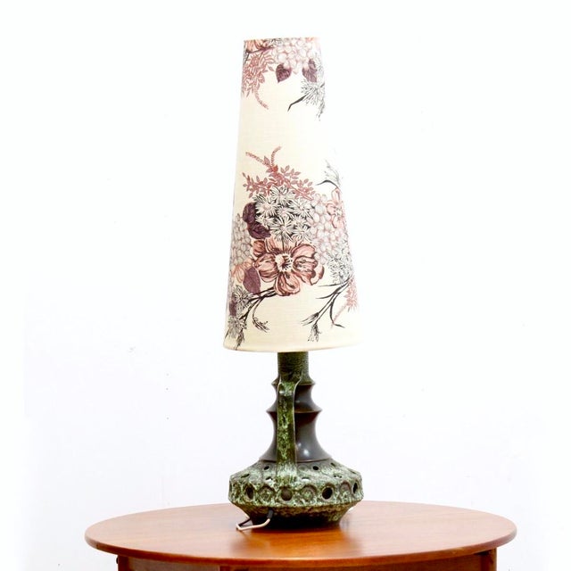 Large ceramic Mid century West German table lamp. Nice earthy tones and comes with original shade floral shade.