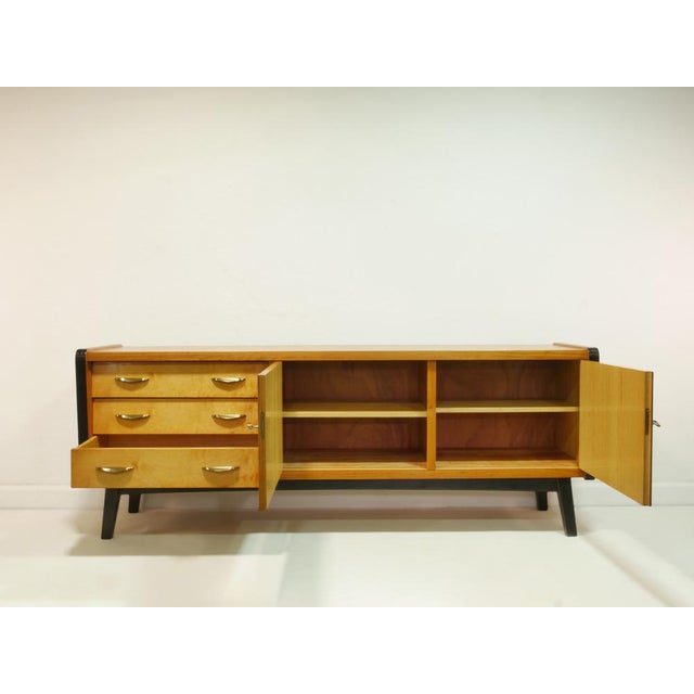 This original vintage sideboard from the 1960s was originally part of a high-quality living room cabinet and now stands...