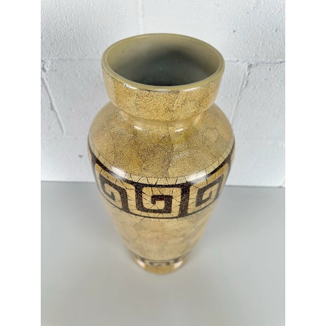 Add a touch of elegance to your home decor with this beautiful Maitland Smith vase. Made of high-quality ceramic, this...