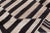 A mid-century Persian Kilim rug from the 1950s, woven in a striking black and ivory palette. The minimalist design...