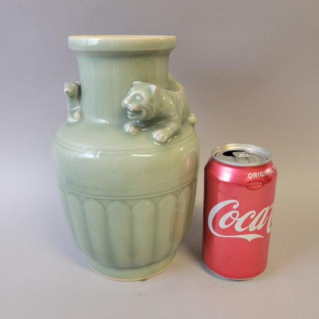 A vintage Chinese export celadon-glazed vase, circa 1970s–1980s, featuring applied sculptural mother tiger and her cub...
