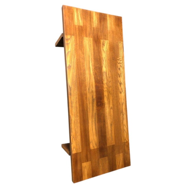 This large mid-century modern Lane Brutalist oak coffee table is a stunning piece of furniture for any living room. The...