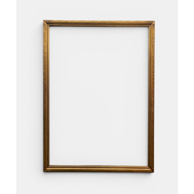 This exceptionally large Renaissance Revival giltwood picture frame by Newcomb-Macklin, measuring an impressive 55 inches...