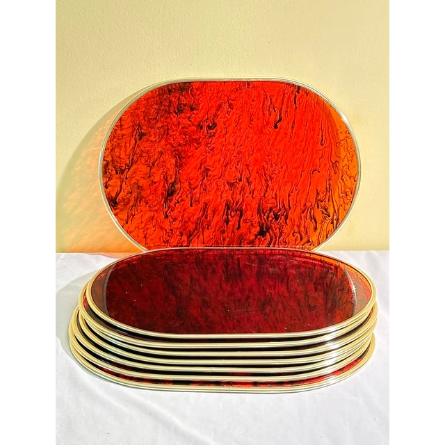 Fabulous set of 8 faux tortoise placemats. Each has gold edging. Perfect to add a glam touch to your dining table this...