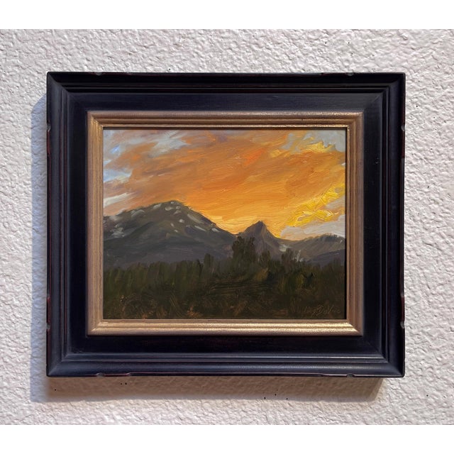 This oil painting captures a serene sunset over the mountains of Summit County, where vibrant hues of orange and gold...