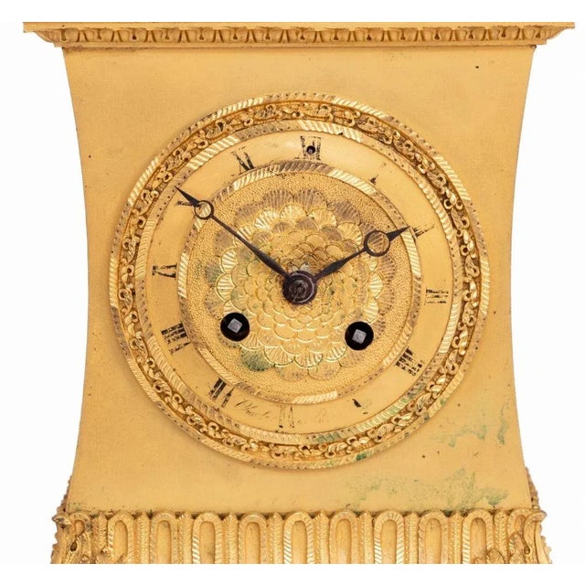 Charles X "The Serpent and The Eagle" Ormolu Clock, circa 1830, the circular dial with strike on bell movement, signed...