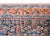 An early 20th century Persian Malayer rug with a central field with an all-over floral and leaf pattern, surrounded by a...