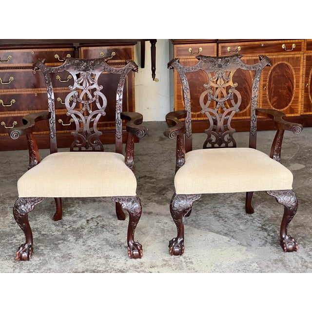 Mahogoan Karges style chippendale chairs with ball and claw front feet and sweeping cabriole back leg. The tops of the...