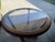 Selling a beautiful vintage round dining table featuring a glass top and a unique, stylish interlocking geometric wood...