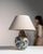 This 1970s table lamp from Germany is finished in blue, worked in ceramic. Its form follows honest, well-proportioned...