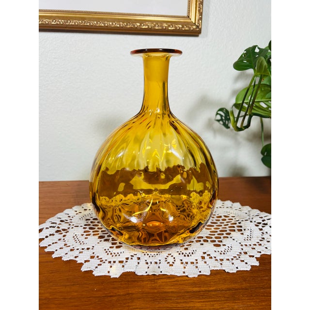 This lovely Blenko Glass Decanter is a spherical optic dot technique decanter with deeply pinched sides and ball designed...