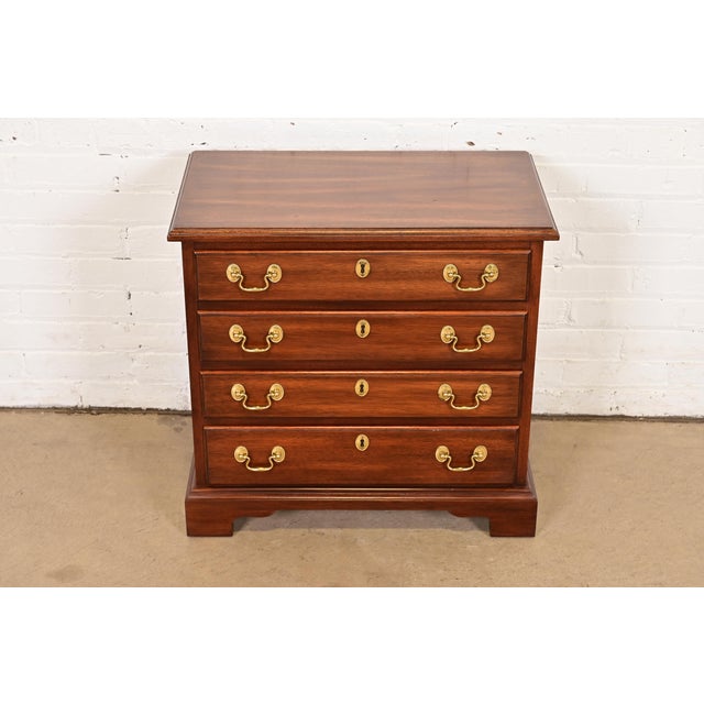 A beautiful Georgian or Chippendale style three-drawer commode, bedside chest, or bachelor chest of drawers By Henkel...