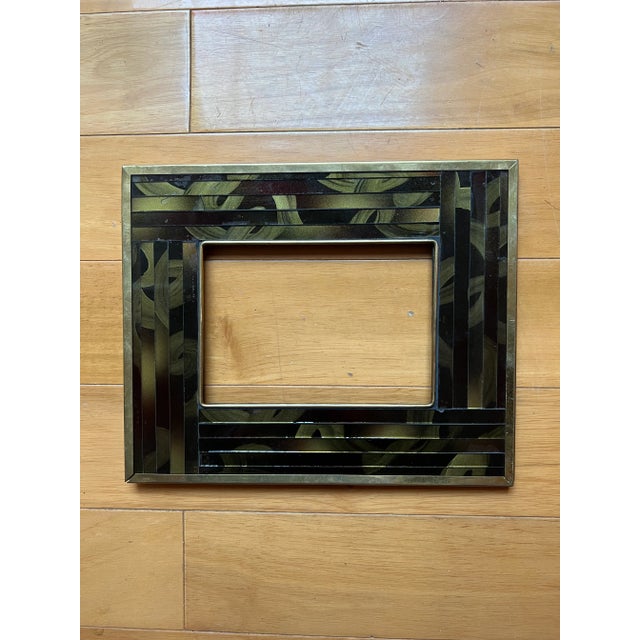 Small but beautiful frame with gold and black glass mosaic and brass perimetric finishing. Purchased at an estate sale. No...