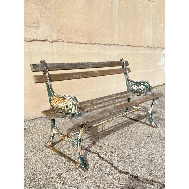 Antique English Victorian Cast Iron Wooden Slat Garden Seat Patio Park Bench. Item features a cast iron leafy scroll...