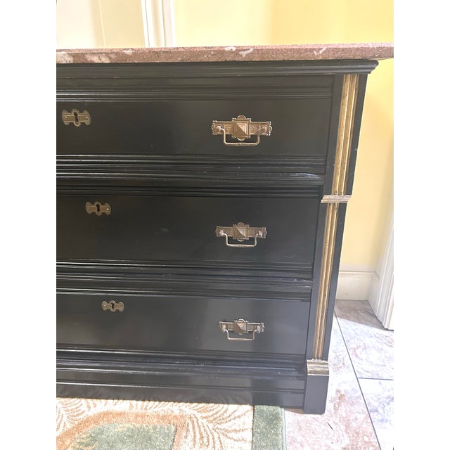 Neoclassical Vintage, Ebonized Wood Commode, Featuring a Marble Top, Three Drawers, Gilded Bronze Mounts, and Gilded Accents on Pilasters, in the Style of Eastlake For Sale - Image 3 of 10
