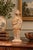 This finely modeled terracotta figure represents a standing court lady from the Chinese Tang Dynasty (618–907 AD), a...