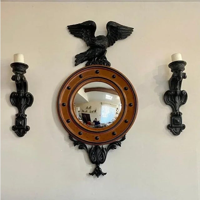 A large Regency style mirror with birds eye maple round frame and domed glass central mirror. Topped with a large hand...