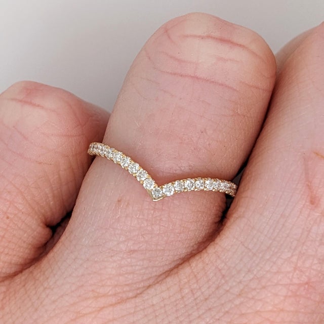 A stackable shadow band with natural diamond accents in 14k solid gold that can sit with your ring perfectly, or be worn...