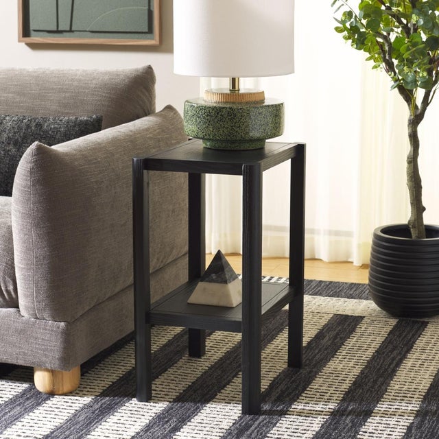 Introducing the Hendro Accent Table! Lovingly crafted in a sleek black finish, this must-have piece shines with style to...