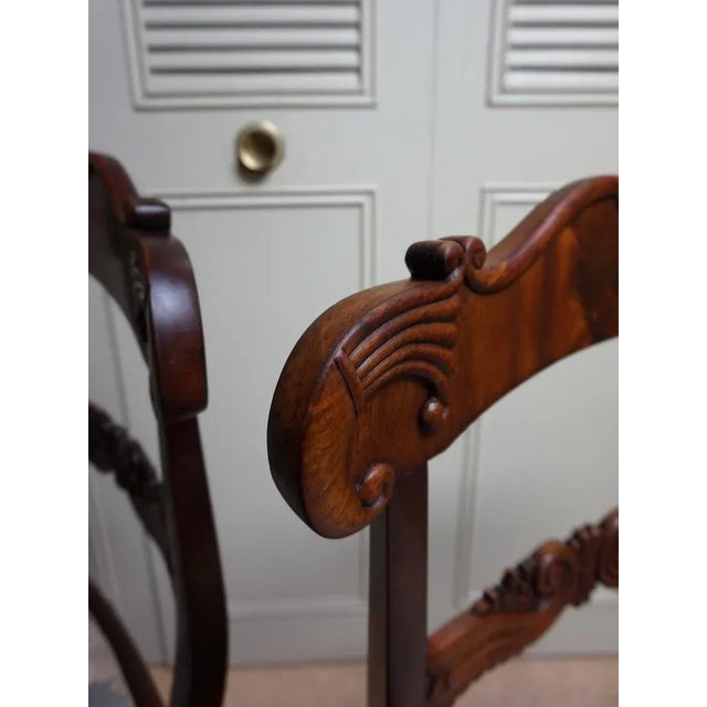 Set of 2 Regency mahogany cornucopia dining chairs, English c.1830-1840 Solid mahogany. The top rail of the backrest is in...