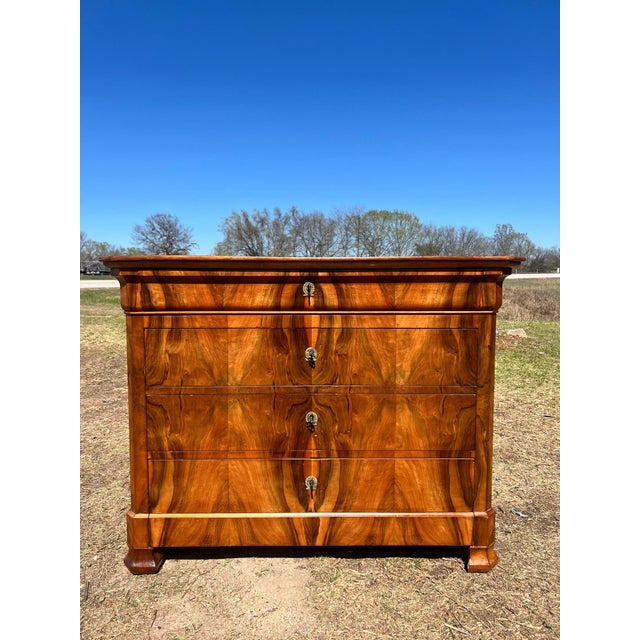 19th Century French Louis Philippe Commode from Lyon France. Made of burl walnut, the wood has been finished with a...