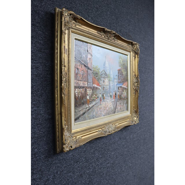 Charming European street scene oil painting depicting a lively Parisian boulevard with figures, storefronts, and the...
