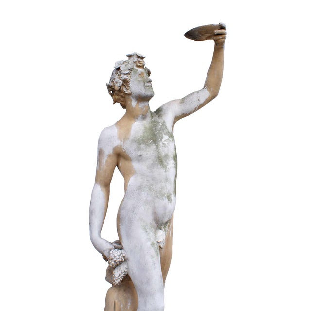 Antique Greco-Roman style terracotta garden statue with the figures of Dionysus/Bacchus and a satyr/faun based on imagery...