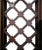 Pair of antique arched wooden double entry doors with metal grates in frame. Carved mahogany type wood has been restored...