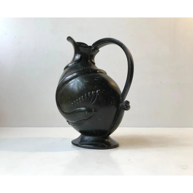A very early Art Deco styled jug made in Denmark during the 1920s. It is made from Disko Metal an alloy made mainly from...