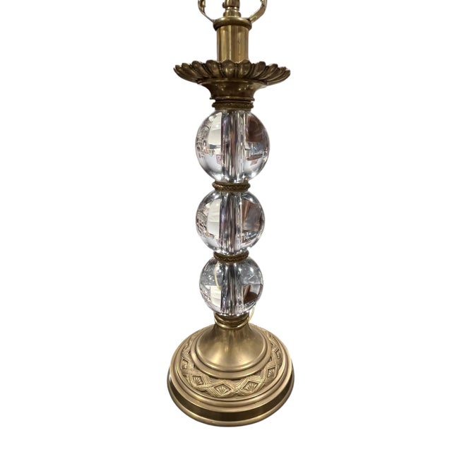 Stacked glass ball lamp with antique brass fittings from Decorative Crafts' Hand Crafted Imports collection. The lamp is...