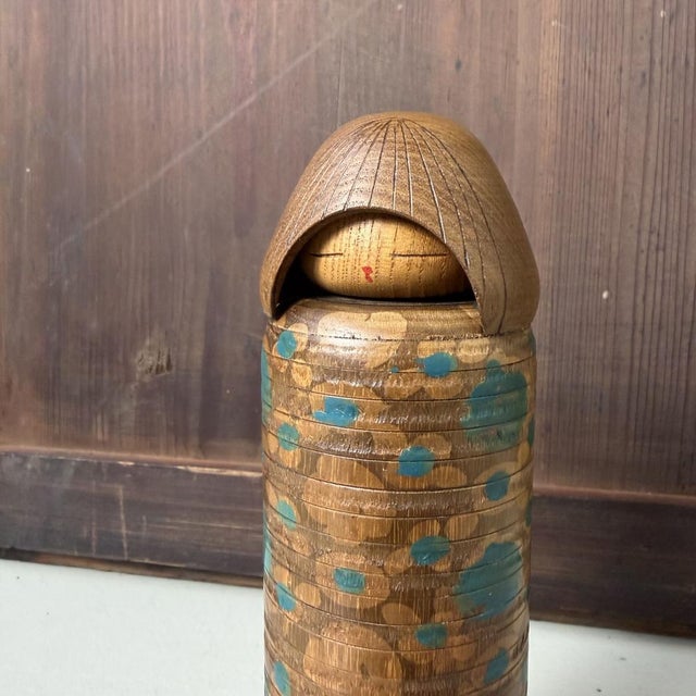 This vintage Japanese sōsaku kokeshi is a design by Miyajima Muhitsu and is titled “Ikat Beauty”. The doll has a sober...
