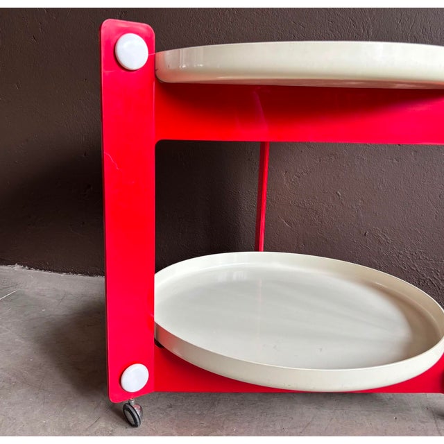Bar trolley with 2 trays, the rare version in red and white, made by Italian manufacturer Guzzini, and designed by Luigi...
