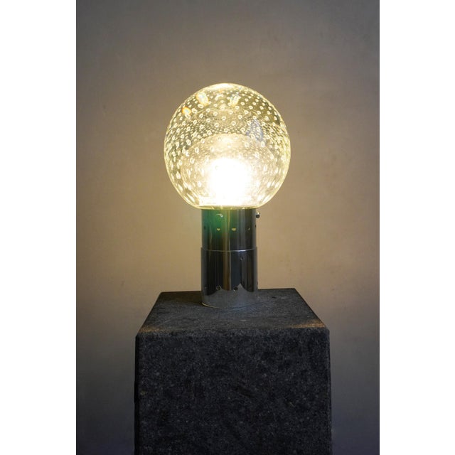 Pendant lamp designed by Gio Sarfatti and Archimede Seguso. Chromed brass, solid buliding glass. Italy, 1960s. I have...